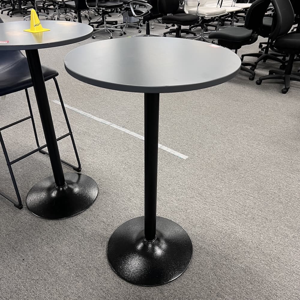 grey round top pub table with black metal base, bar height standing table, collaboration, dining, catering, used furniture