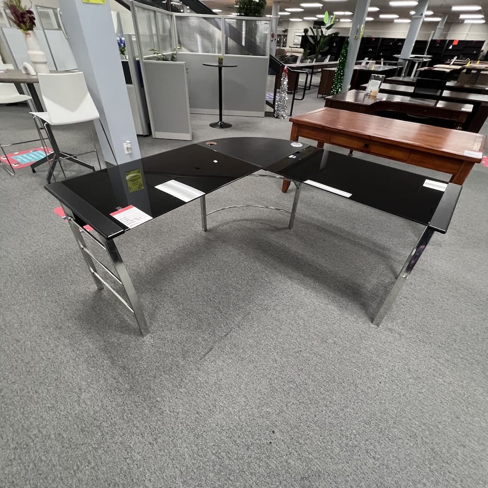 black glass l-desk with chrome accents, used office furniture