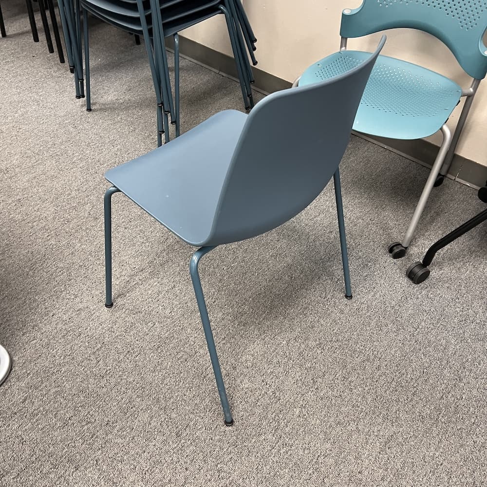 teal plastic stacking chair, vary Simon genteelly incase, used office furniture