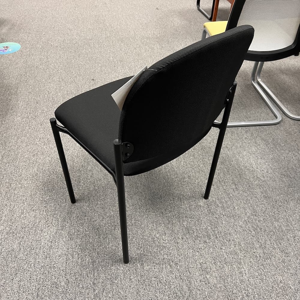 Office factor new closeout upholstered black stacking chair, armless, office furniture
