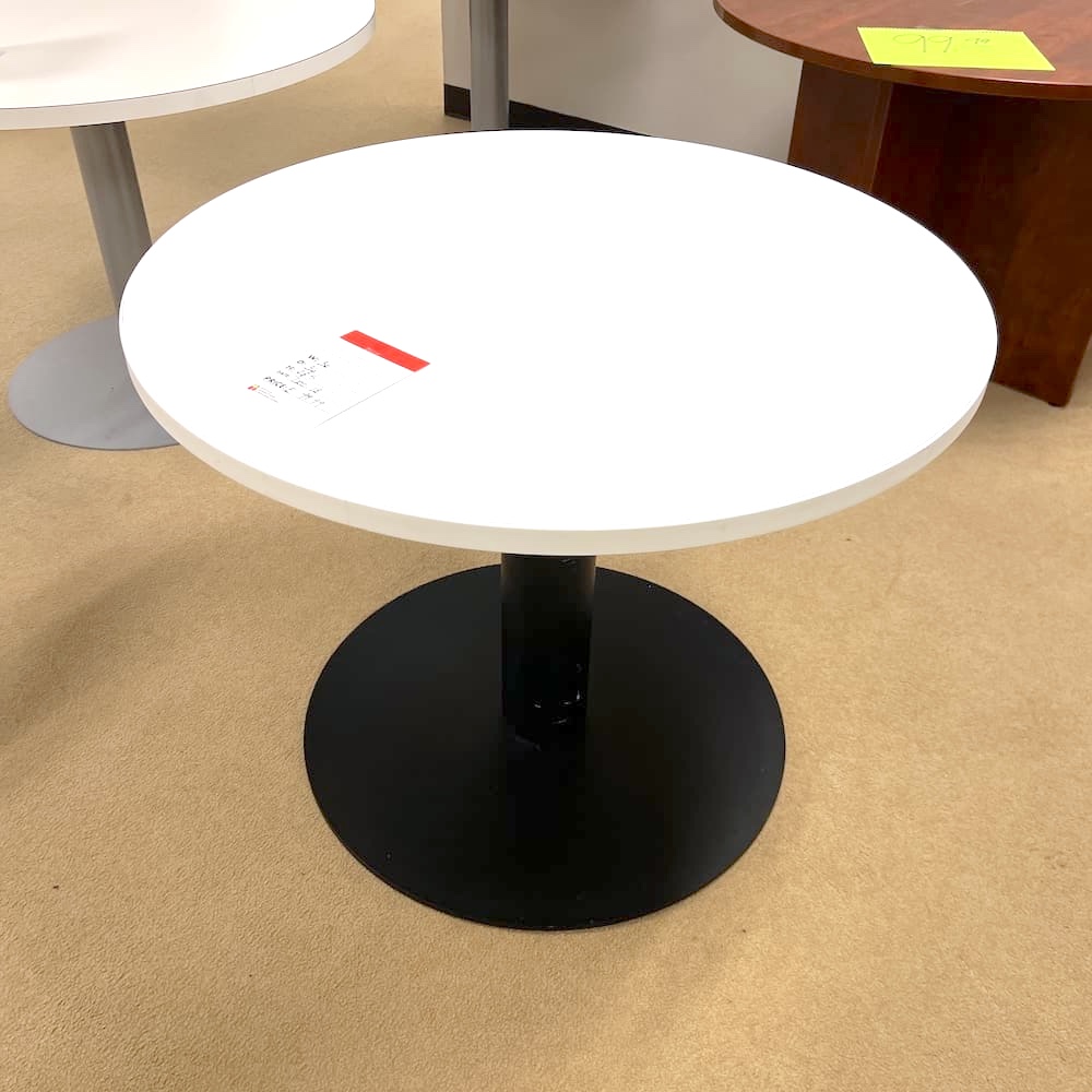 white laminate round break room table with black metal base, used office furniture