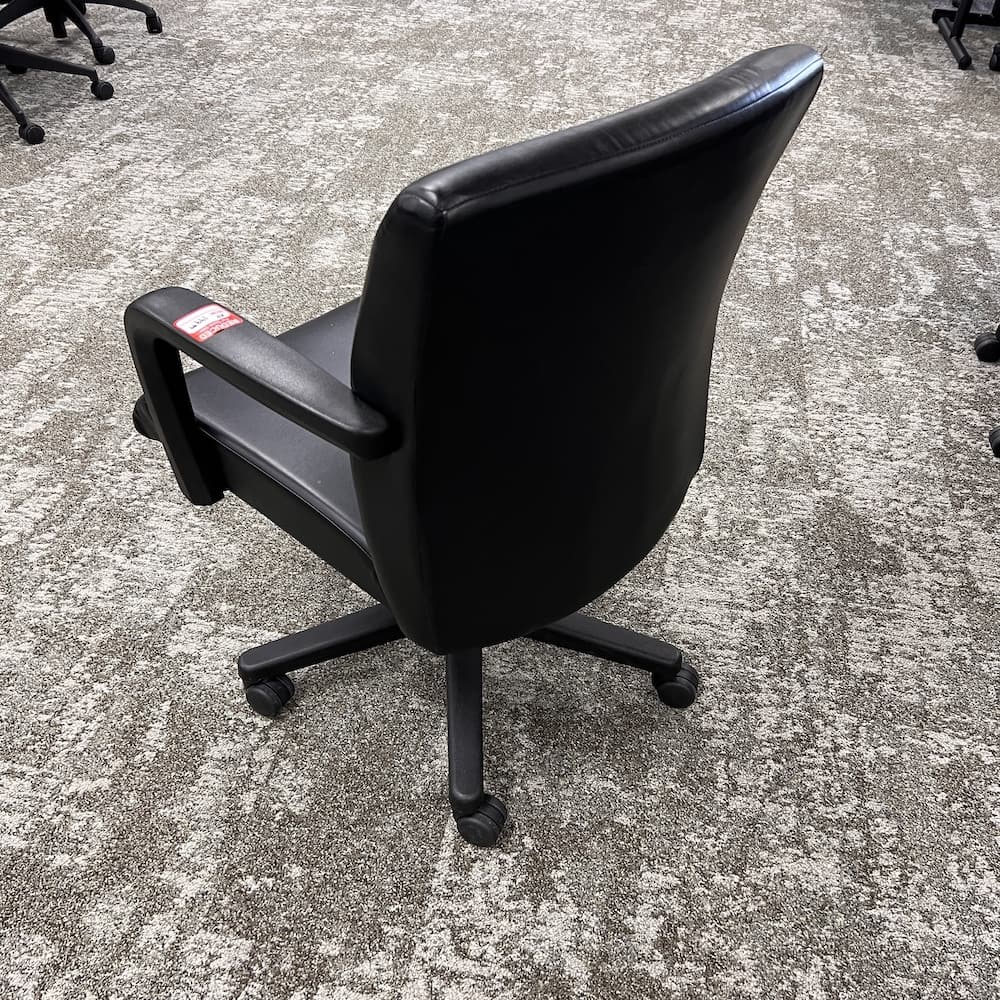 black Kimball stature chair, conference chair, bris, bed office furniture