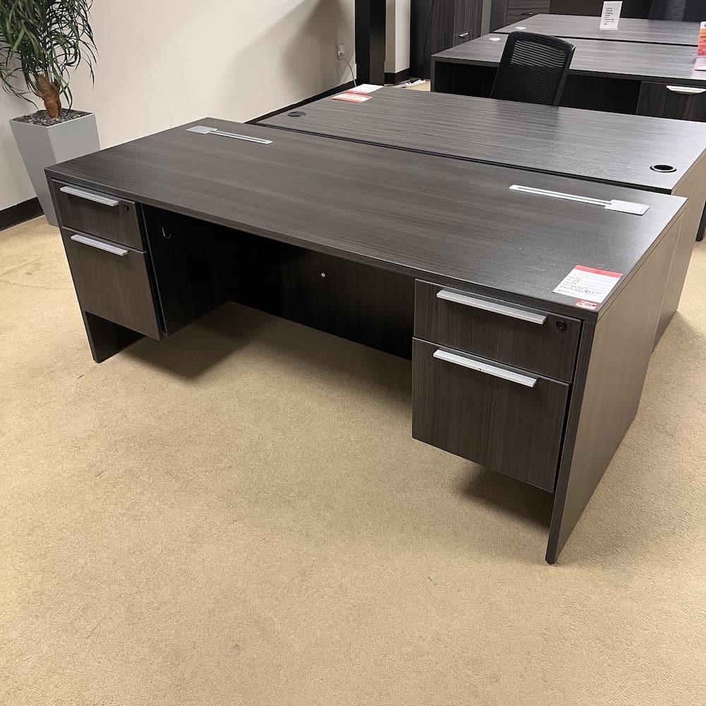 grey laminate desk with silver pulls and cord management, used office furniture