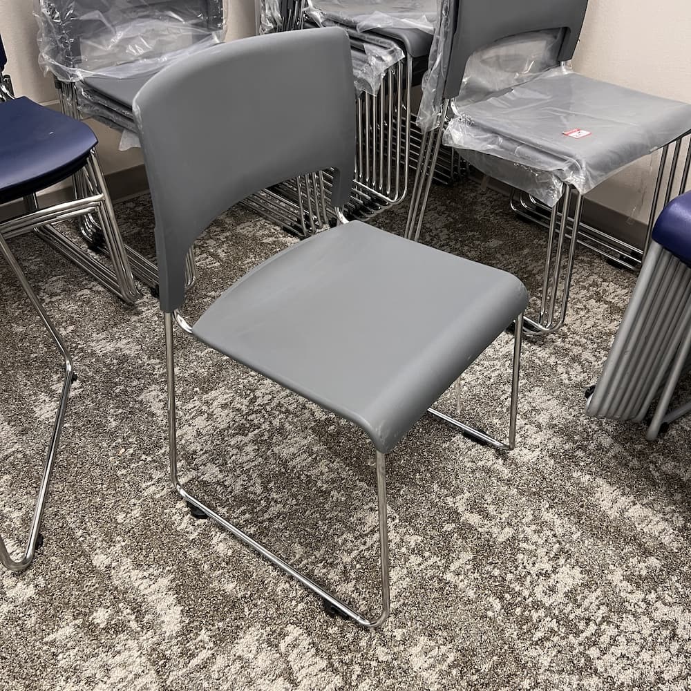 grey plastic stacking chair, used office furniture