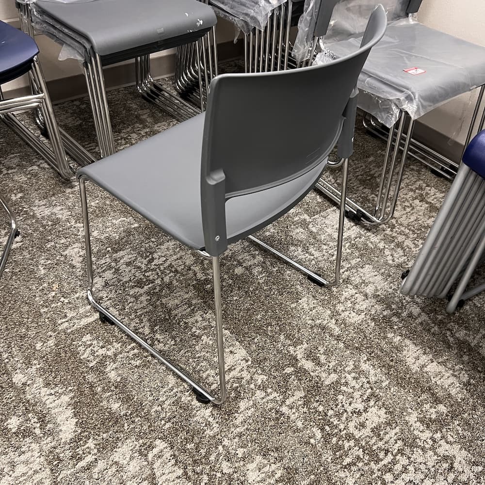 grey plastic stacking chair, used office furniture