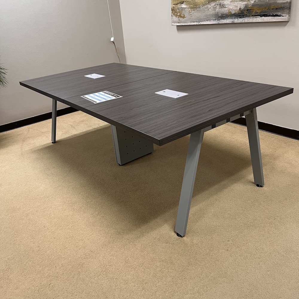 grey rectangle conference table with angled silver legs, 2 sets of legs, silver chord port holes