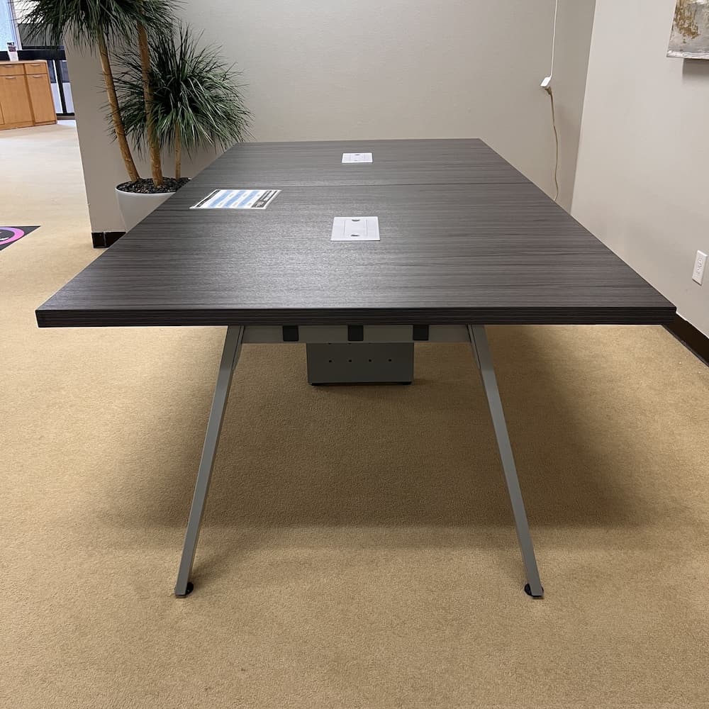 grey rectangle conference table with angled silver legs, 2 sets of legs, silver chord port holes