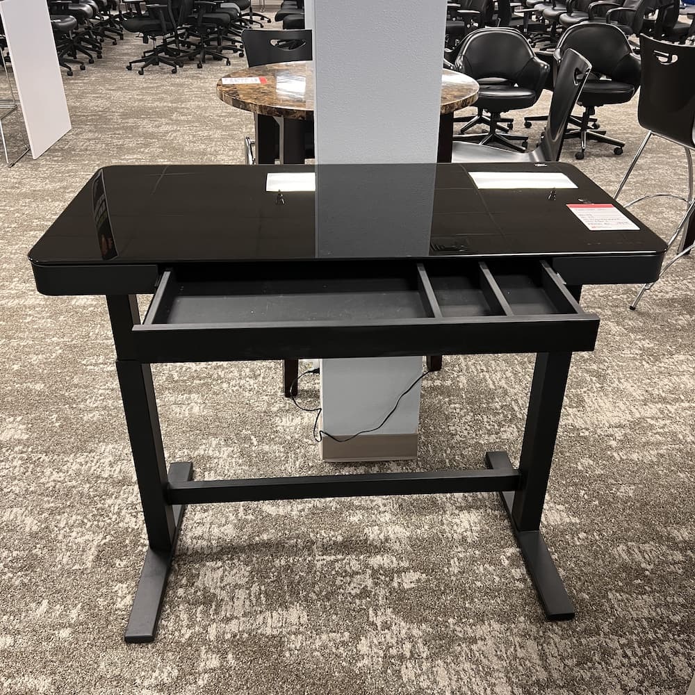 black glass height adjustable desk, twin star int., with lock, usb, center drawer, programmable, Costco. Used office furniture, home office