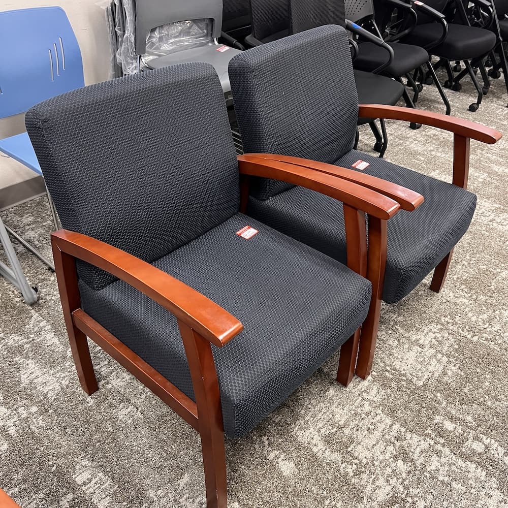 blue an black upholstered guest chair with cherry veneer frame and arms, used office furniture