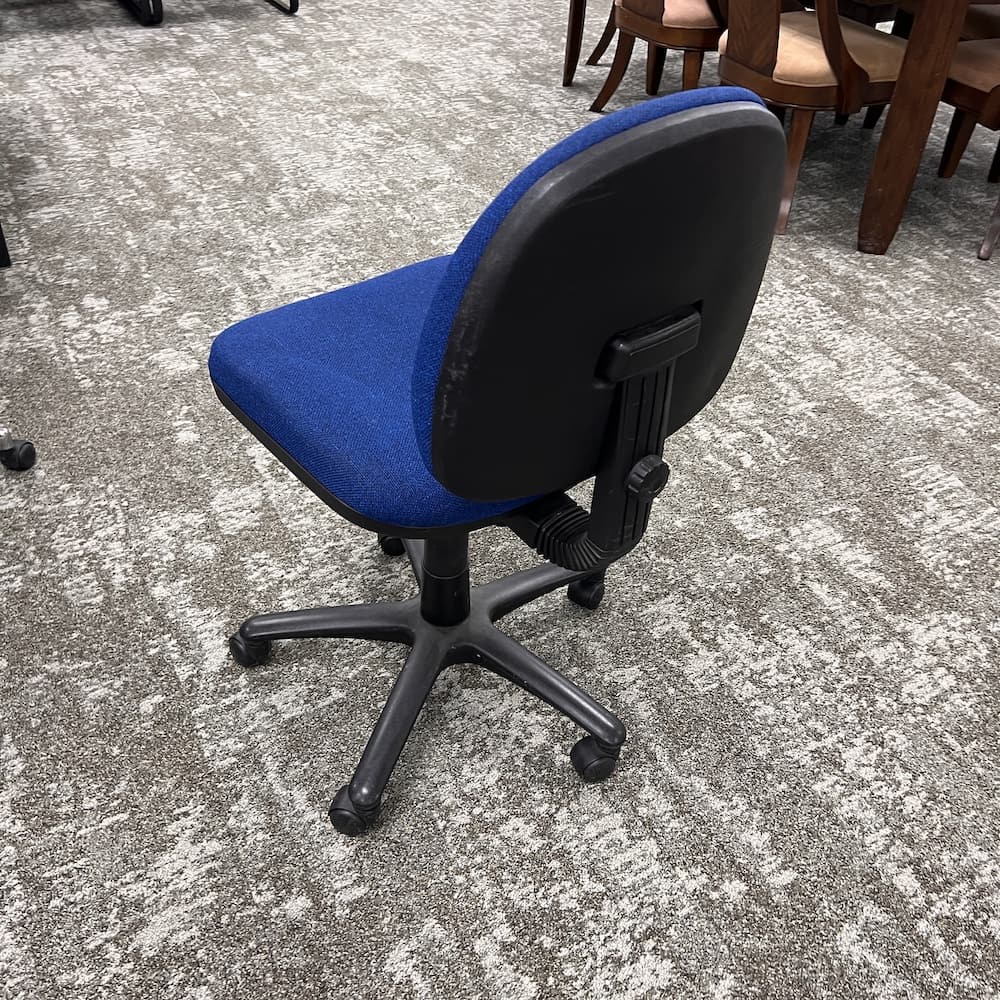 stigmatic armless task chair, blue upholstery, used office furniture