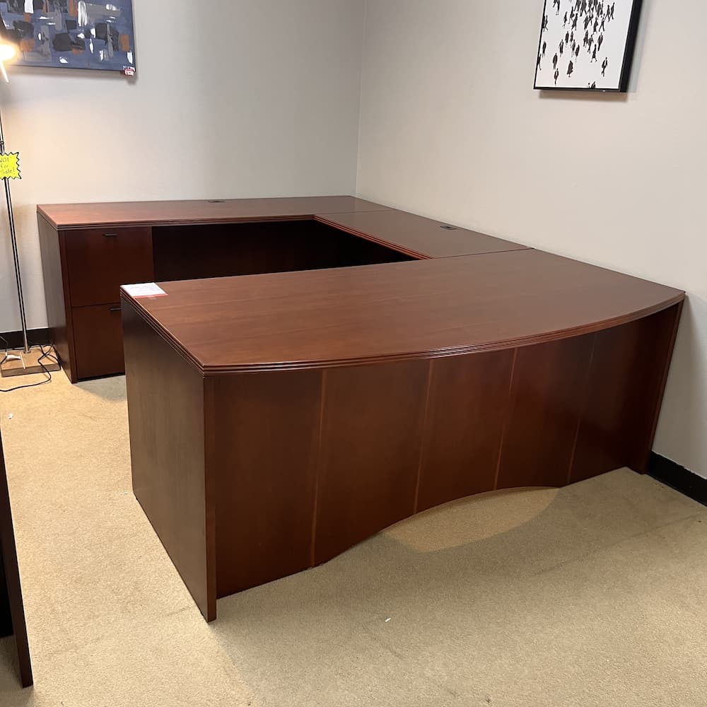 cherry veneer u-desk left return double pedestal and bow front, black handles, used office furniture