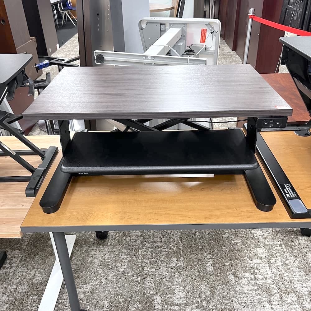 grey laminate top electric desk riser, mantel, used office furniture