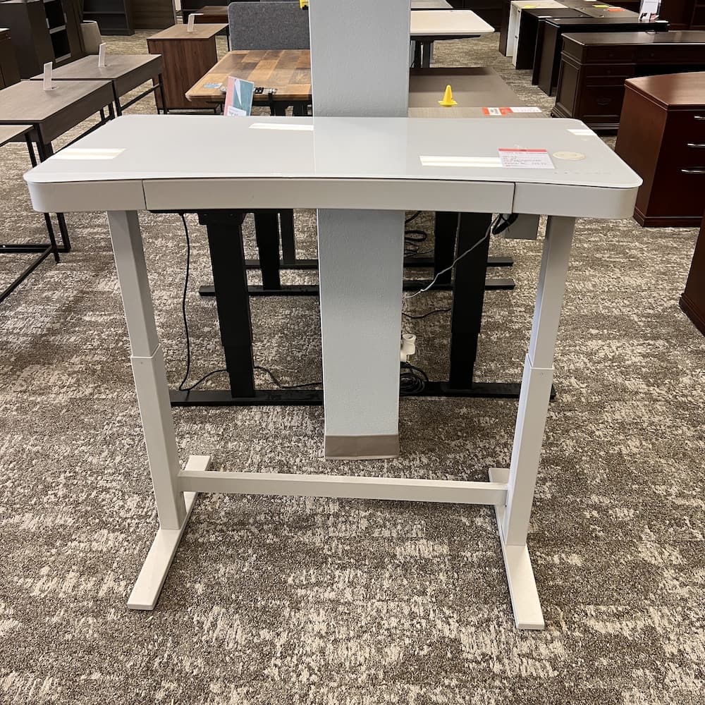 white glass height adjustable desk, twin star int., with charger, lock, usb, center drawer, programmable, Costco. Used office furniture, home office