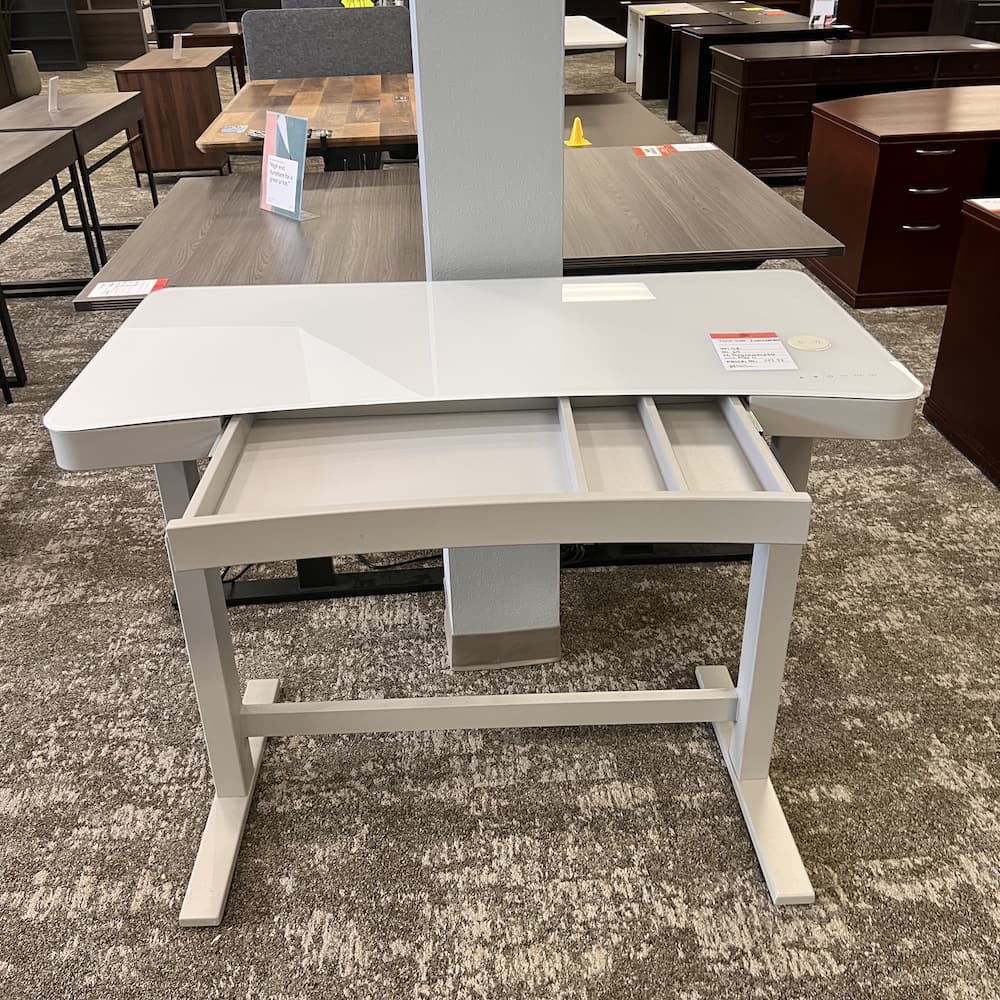 white glass height adjustable desk, twin star int., with charger, lock, usb, center drawer, programmable, Costco. Used office furniture, home office