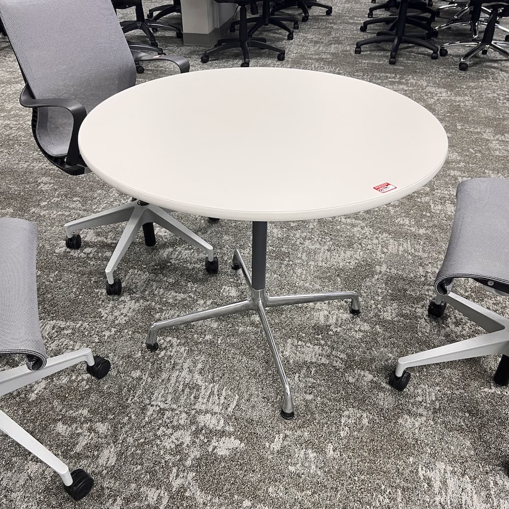 white laminate round table 36" with silver grey Eames base, Herman Miller used office furniture