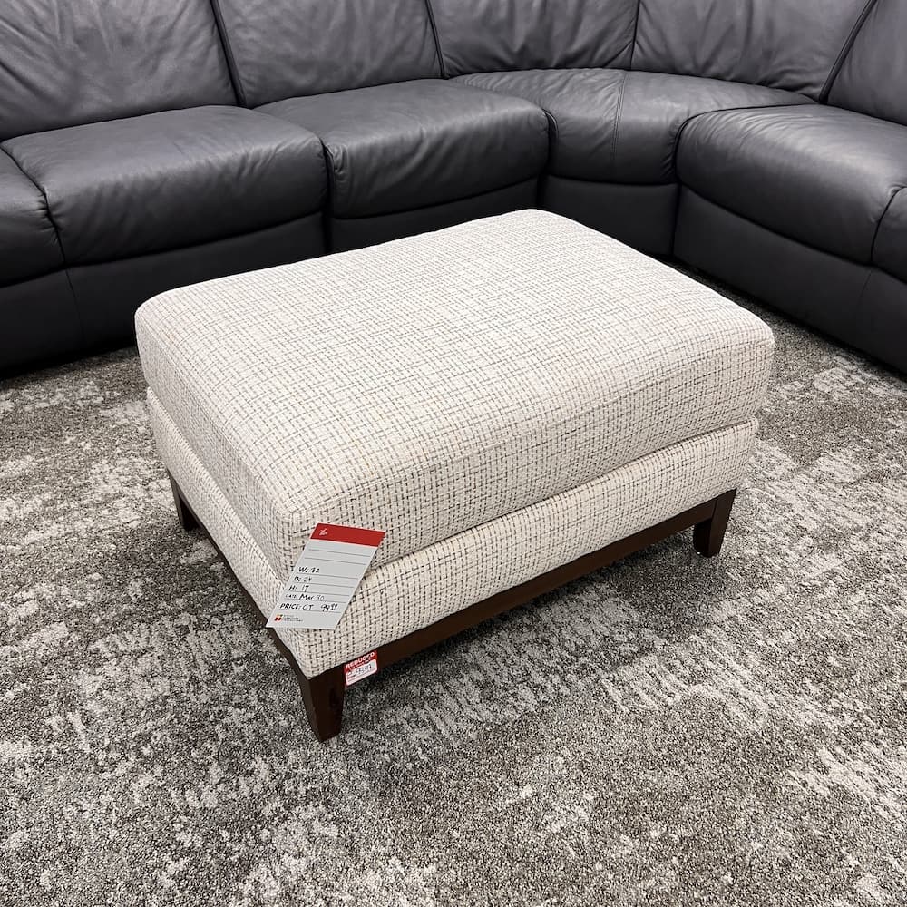 beige upholstered rectangle ottoman