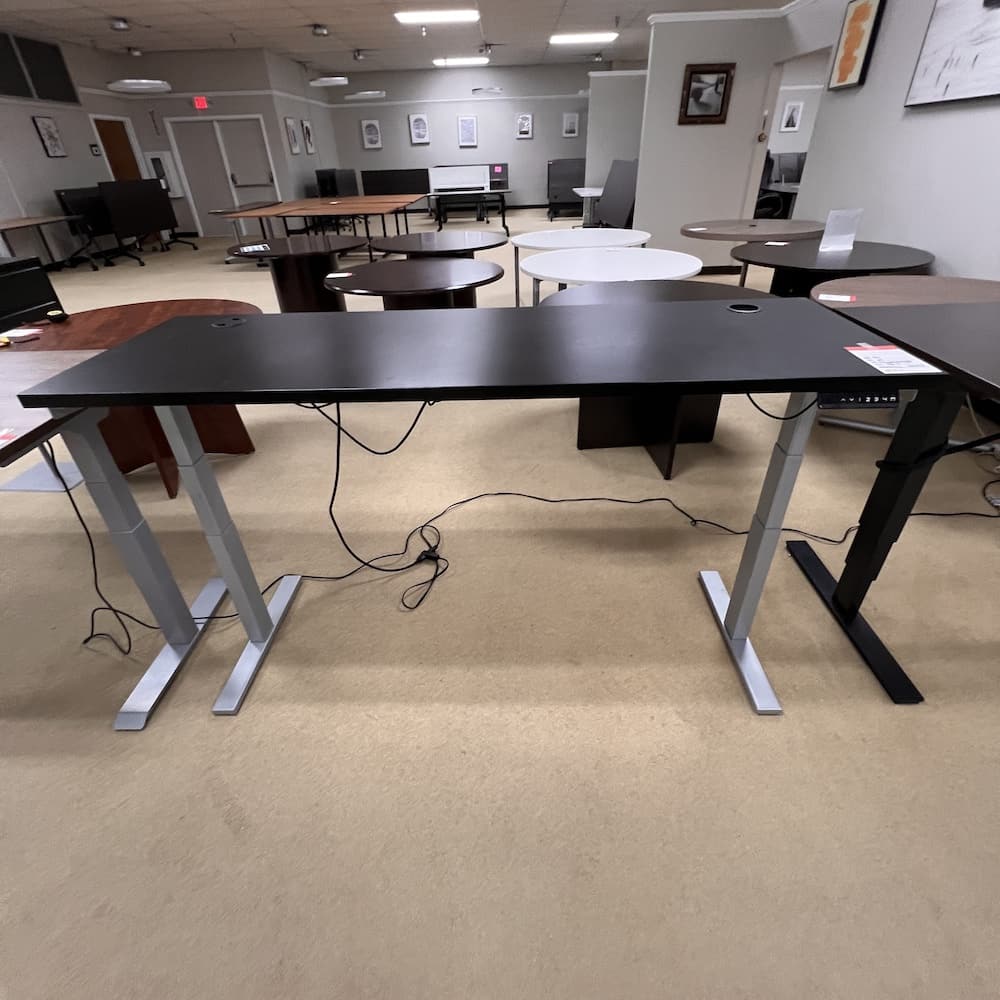 70 x 24 black laminate height adjustable desk with grey base, programmable electric standing, used office furniture