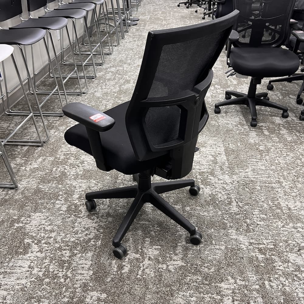 black mesh back task chair with upholstered seat, used office furniture