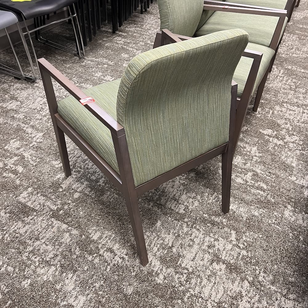 green upholstered lisso guest chair with grey veneer arms and legs, corporate furniture, used office furniture