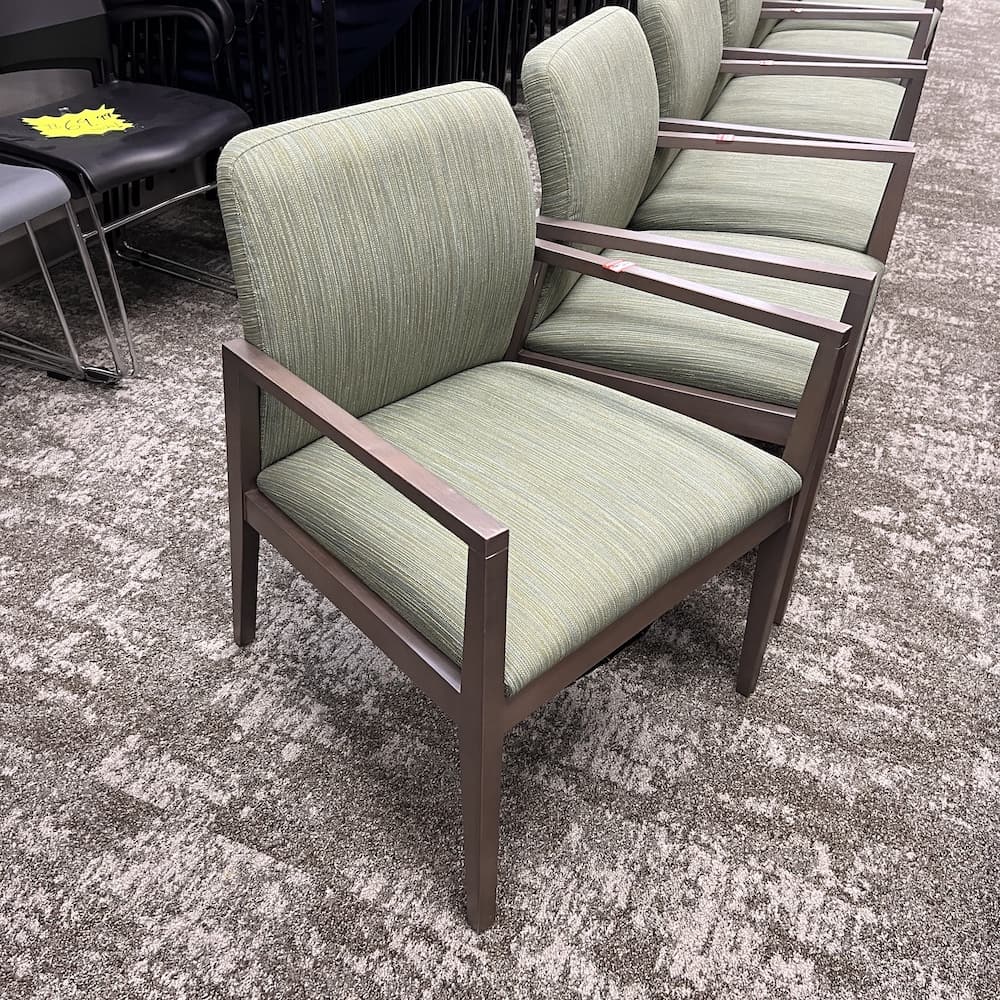 green upholstered lisso guest chair with grey veneer arms and legs, corporate furniture, used office furniture