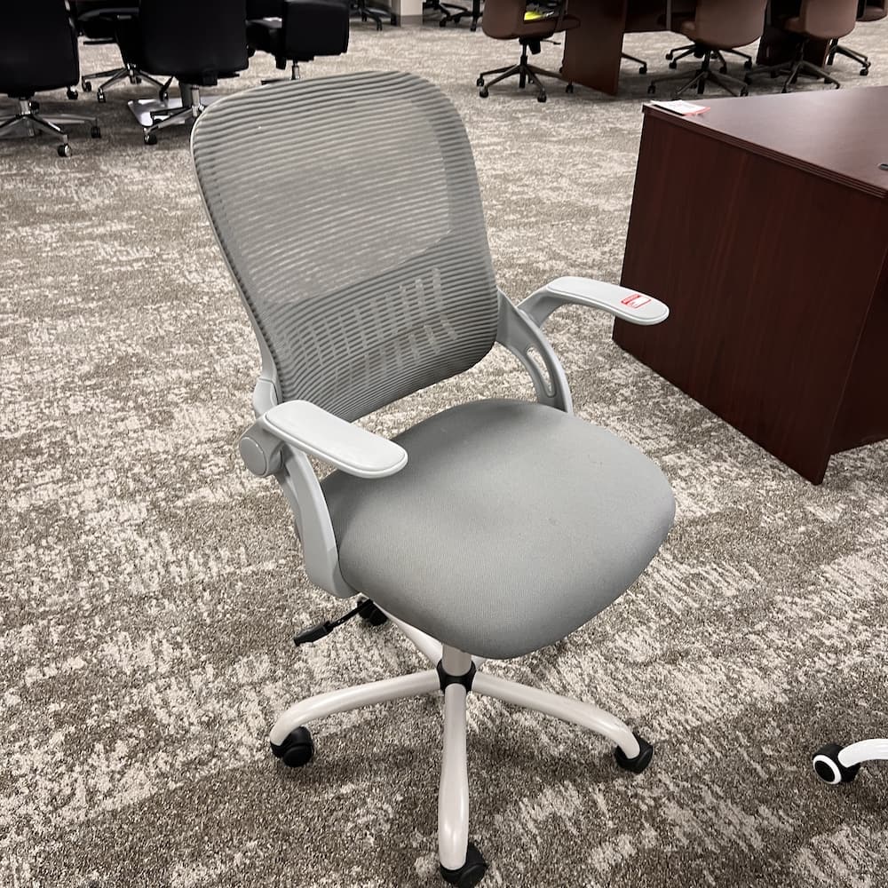 grey and grey mesh back task chair with flip arms, used office furniture
