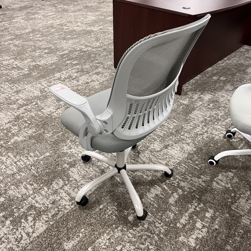 grey and grey mesh back task chair with flip arms, used office furniture
