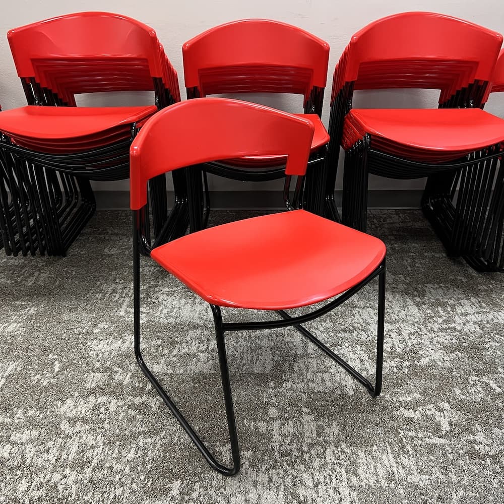 red plastic with black legs stacking chair, 1980's Paolo Favaretto assisa, used office furniture, designer goods, vintage look