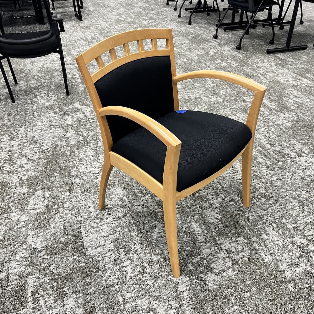 black upholstered guest chair with maple veneer frame. closeout office furniture