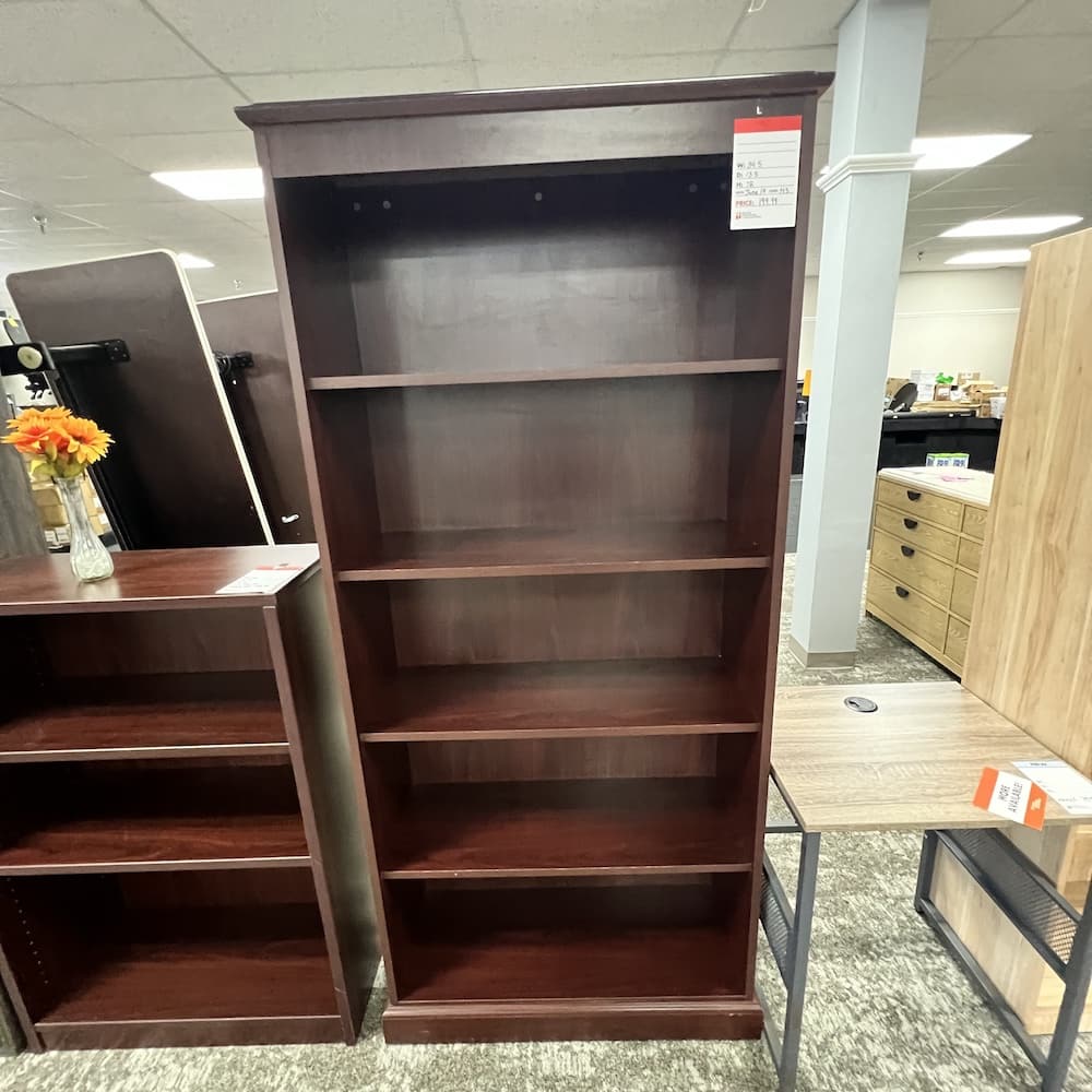 7 ft tall mahogany laminate bookcase with rounded top shoulders, used office furniture
