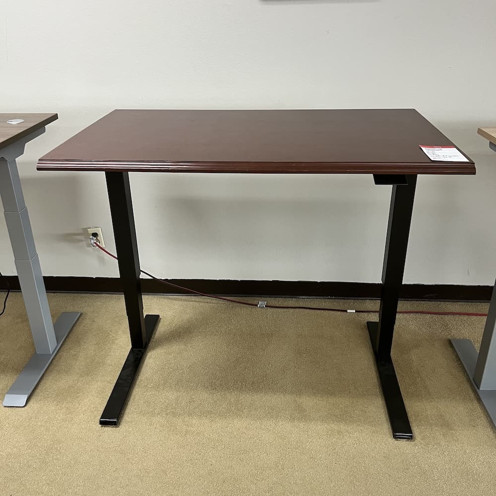 mahogany top with black legs pneumatic height adjustable desk human scale float, used office furniture