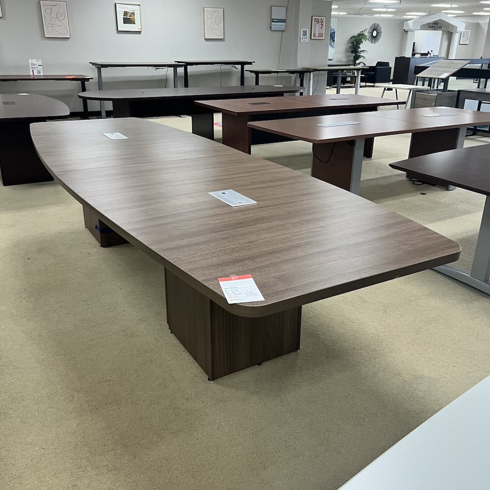 12 ft laminate boat shaped conference table, walnut with slab base, used open box office furniture
