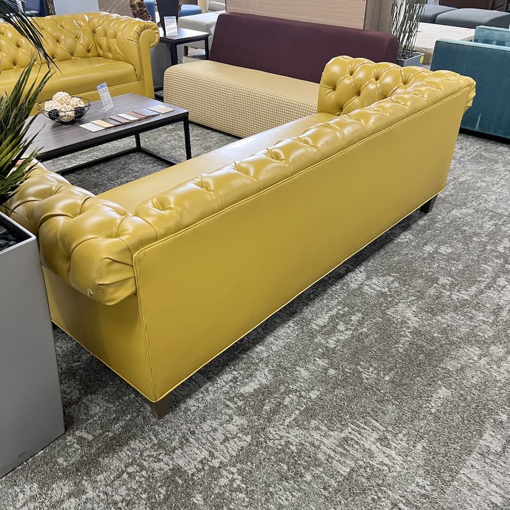 yellow vinyl tufted Chesterfield sofa couch, used commercial furniture