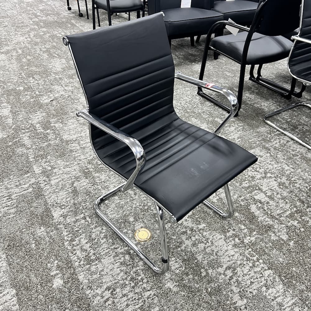 black vinyl ribbed sled guest chair, used office furniture