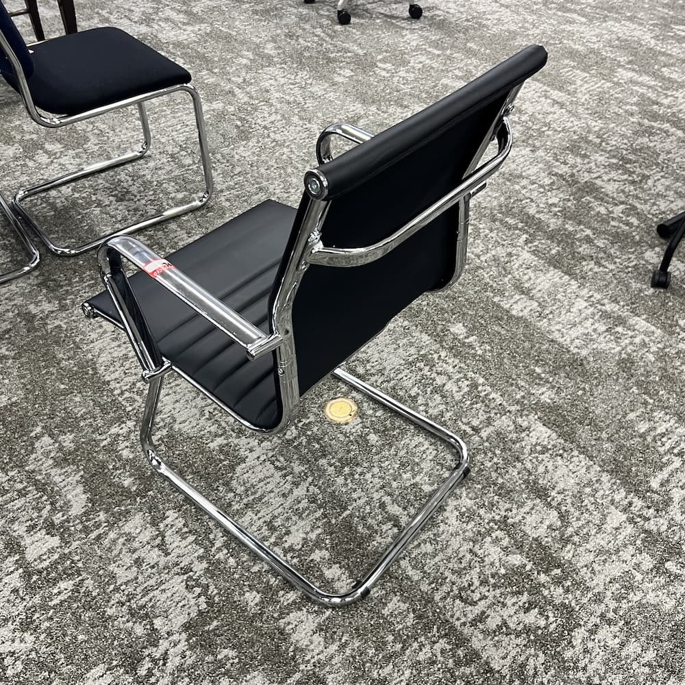 black vinyl ribbed sled guest chair