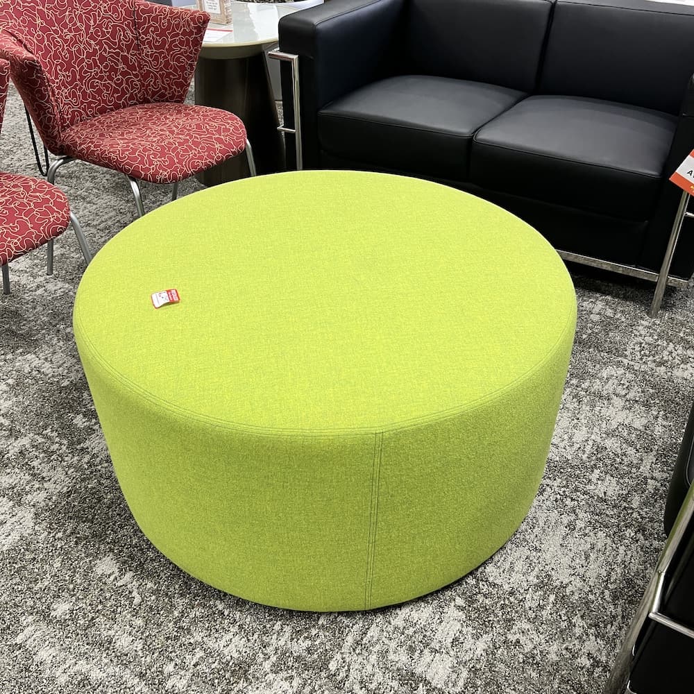 lime green upholstered round ottoman, used office furniture