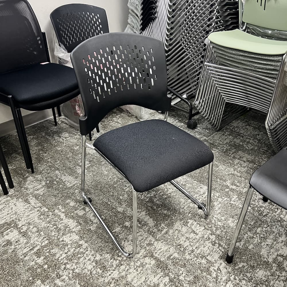 New Closeout - Black Upholstery and Perforated Plastic Back Stacking Chair