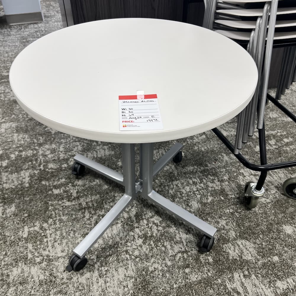 white laminate round table with grey metal x base