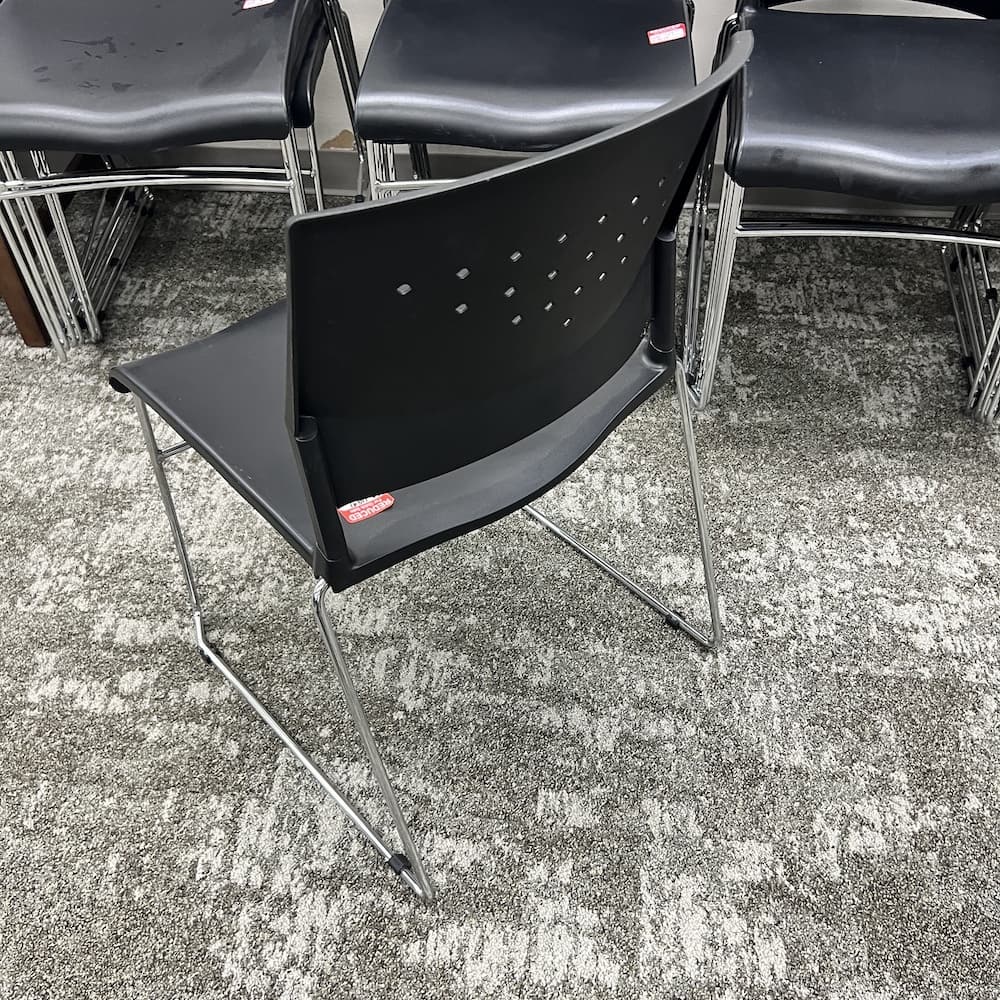 black plastic stacking chair, used office furniture
