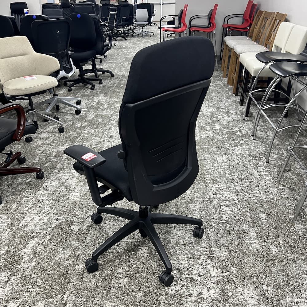 black upholstered teknion synchro tilt saver task chair, used office furniture