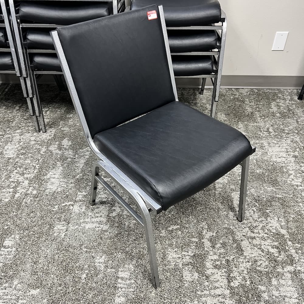 black vinyl Hercules stacking banquet chair, used furniture