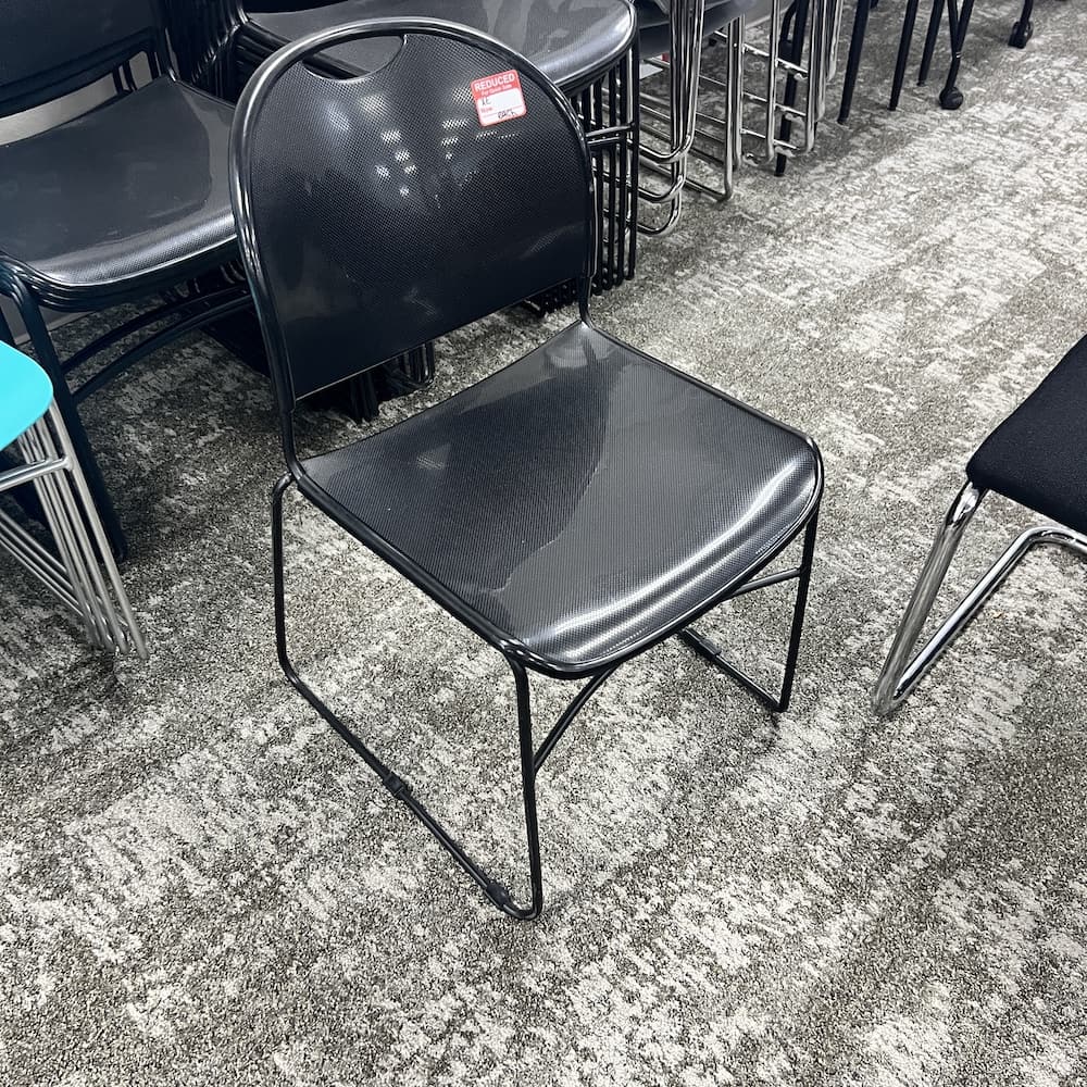 black plastic stacking chair, used office furniture