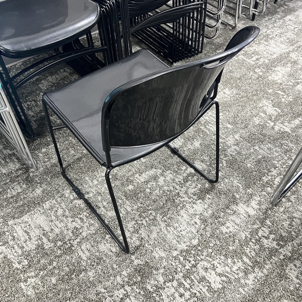 black plastic stacking chair, used office furniture