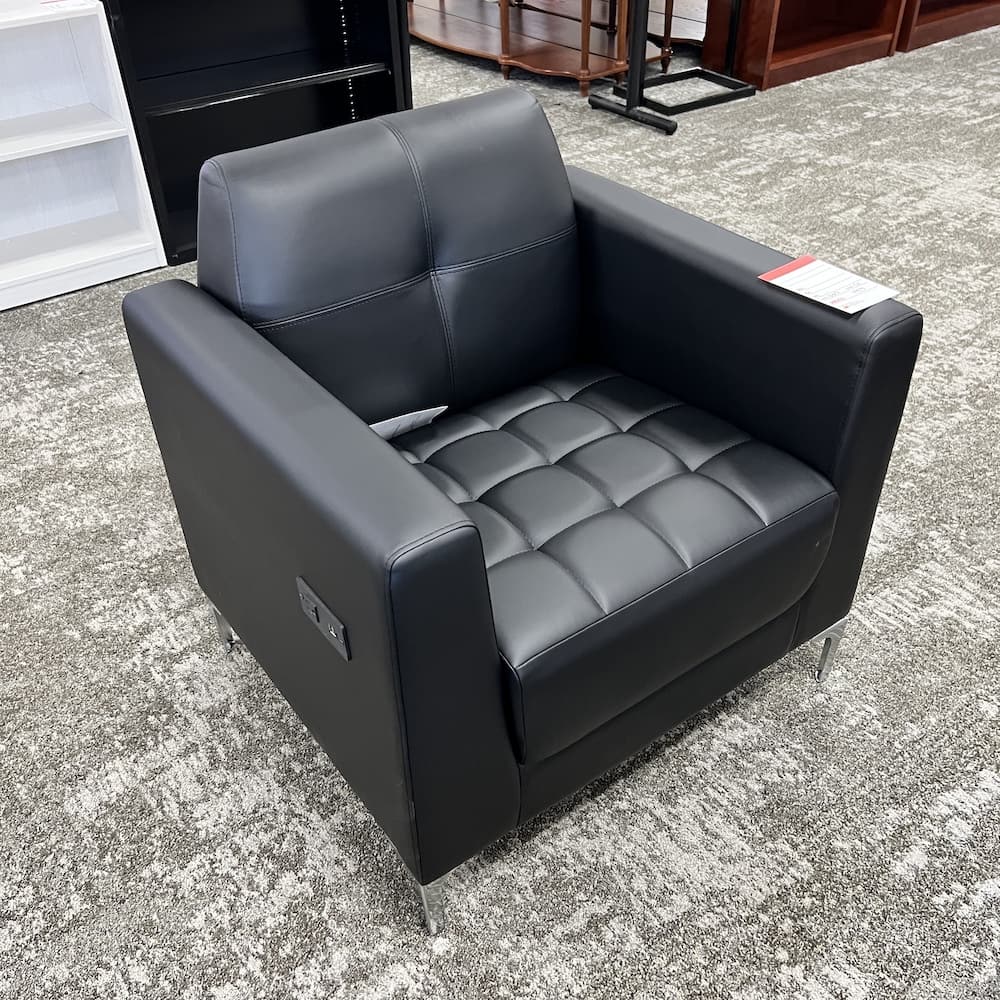 black vinyl lounge chair with chrome legs and power plug, open box commercial furntiure
