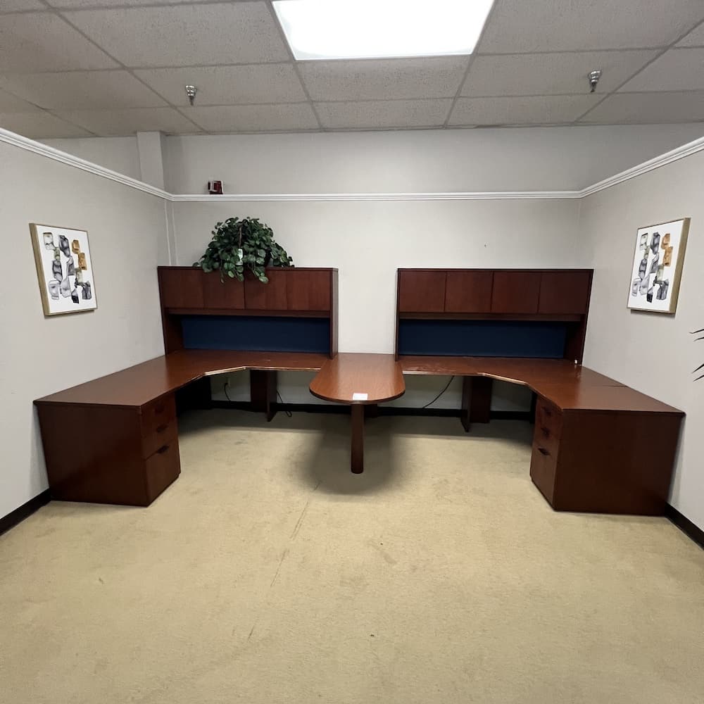 2 person workstation desk with bullet nose center and two hutches with 4 doors. used office furniture